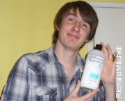 Mitch holding a bottle of TRESemmé
