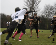 York defensive back, Tom Platts breaks up a pass as Alex Nock, #29, looks on.
