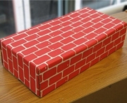 Defective By Design Brick